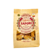 Face avant du paquet de Cantuccini Toscani I.G.P. aux amandes de la marque Sapori, 250g, avec fenêtre transparente laissant voir les biscuits.