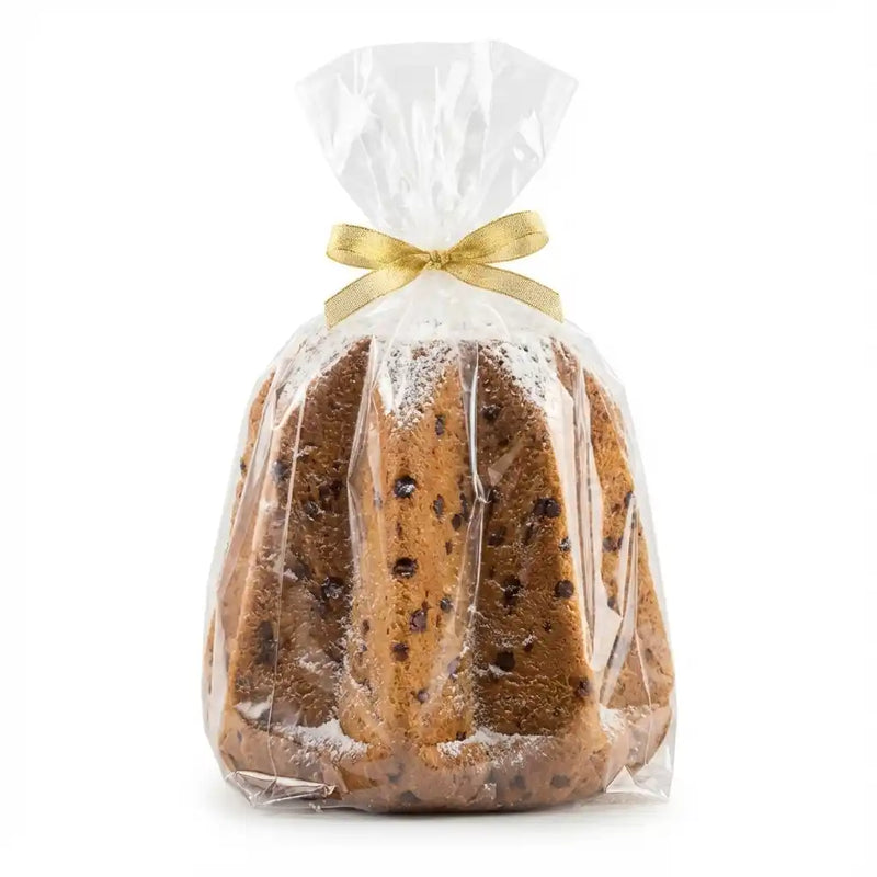 Pandoro italien aux pépites de chocolat emballé dans un sachet transparent avec ruban doré