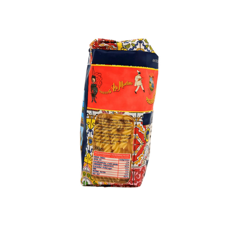 Côté gauche du paquet de Tortiglioni Pastificio Di Martino 500g - Informations nutritionnelles et aperçu des pâtes à travers la fenêtre transparente.