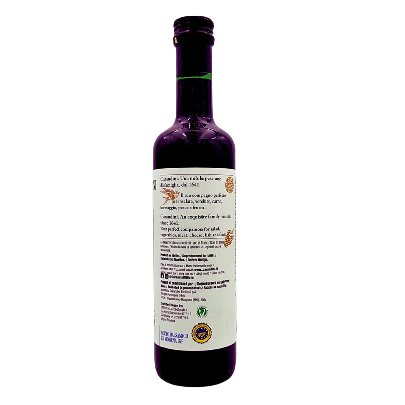 Vue latérale du vinaigre balsamique de Modène I.G.P. Carandini 500ml, avec texte de présentation de la maison Carandini et suggestions d'utilisation pour salades, viandes, fromages et fruits.