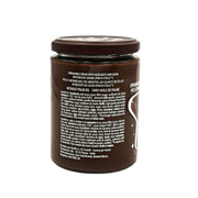 Pot de pâte à tartiner Pan di Stelle Barilla 380g avec éclats de biscuits et étiquette décrivant les ingrédients sans huile de palme.